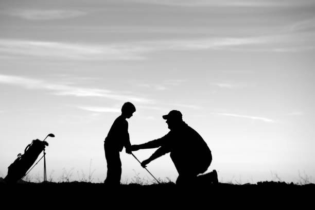 Rob Rossi with students on the golf course